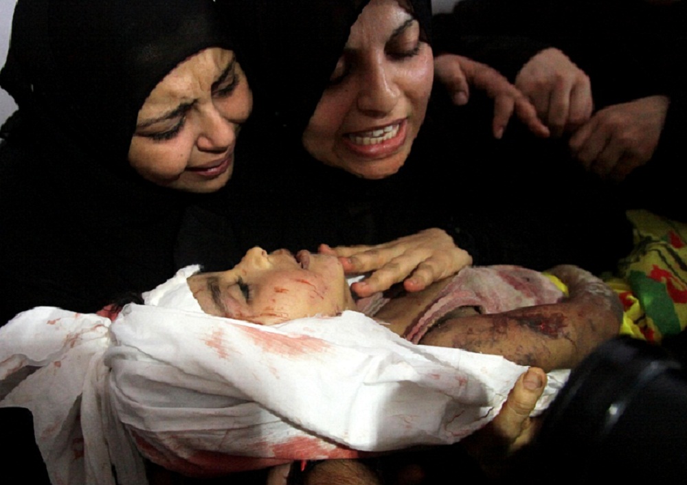 Mourning the Shabir children.  Gaza, July 17, 2014